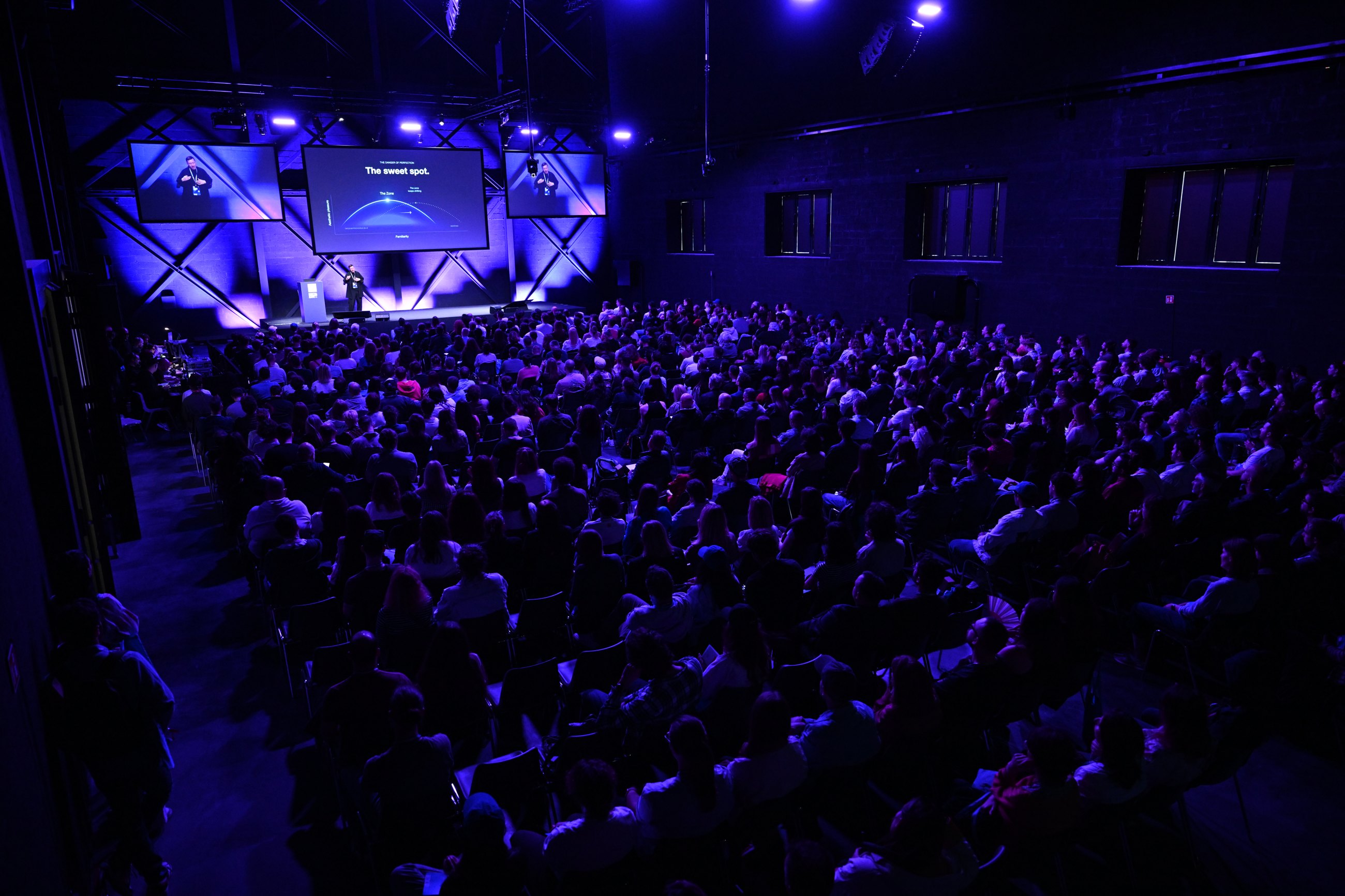 Gleb Kuznetsov giving a keynote to a full hall at Digital Design Days, Milan